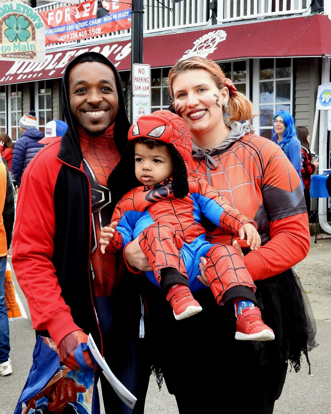 Family of three at Trick or Treat on Main Street in Wauconda
