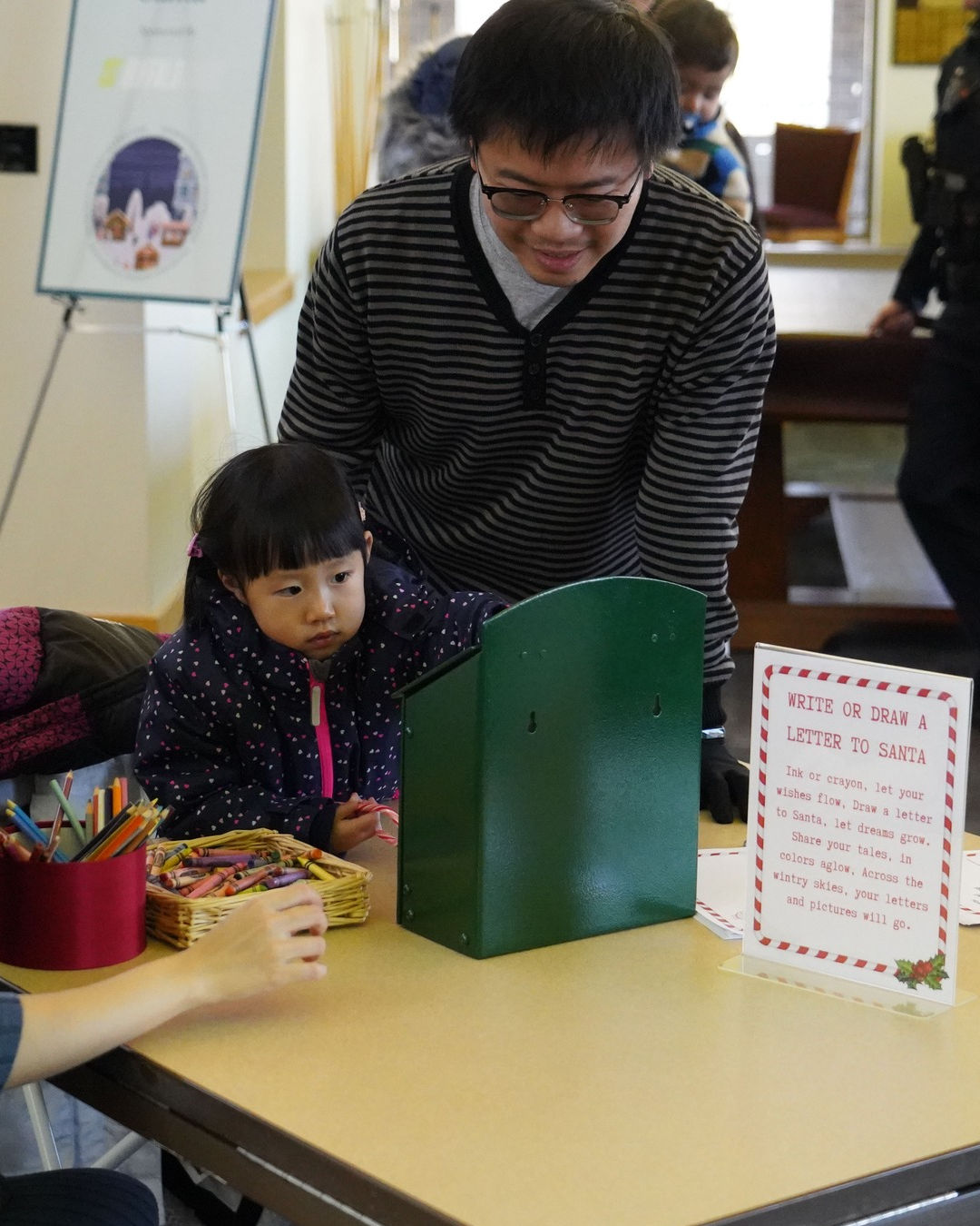 Little girl writing a letter to Santa