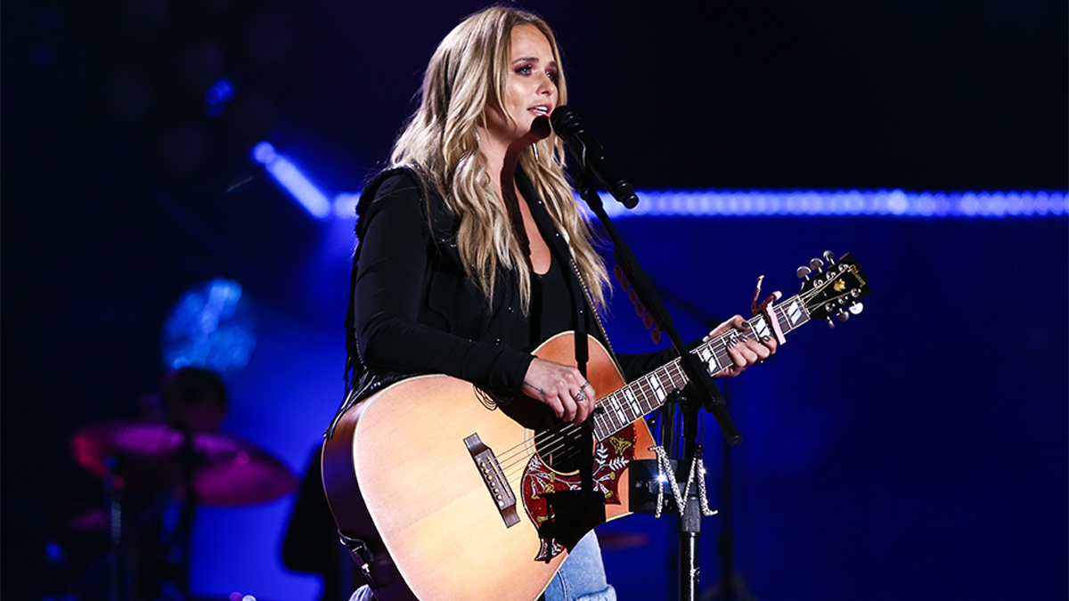 Miranda Lambert Performing while holding a guitar