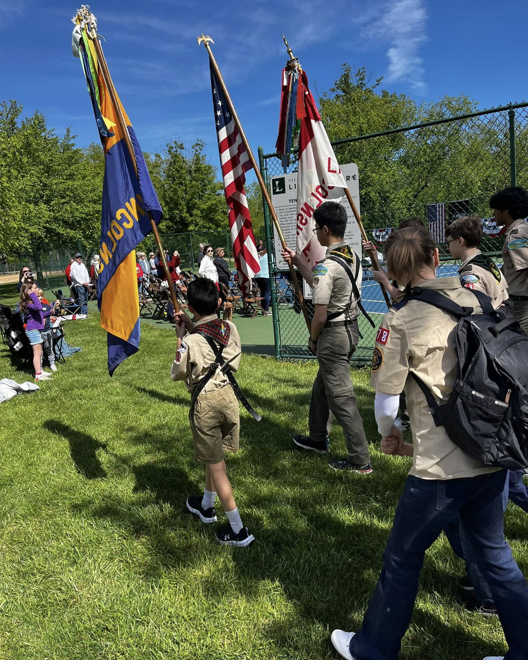 Boy Scouts holding flags at ceremony in Lincolnshire