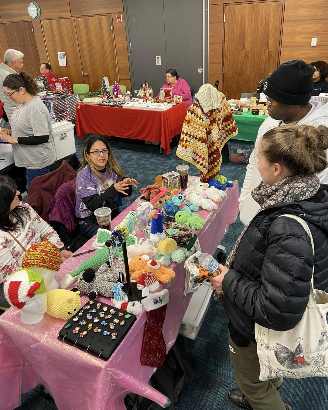 Women shopping at Waukegan Public Library's Kris Kringle Artist Market
